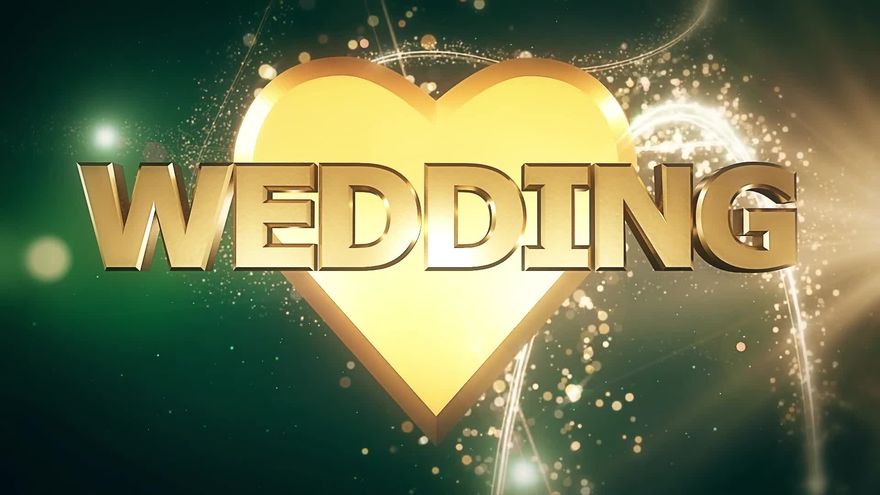 暗い背景の中、黄金の立体的なハートとWEDDINGの文字が現れ、花火が上がるシーン