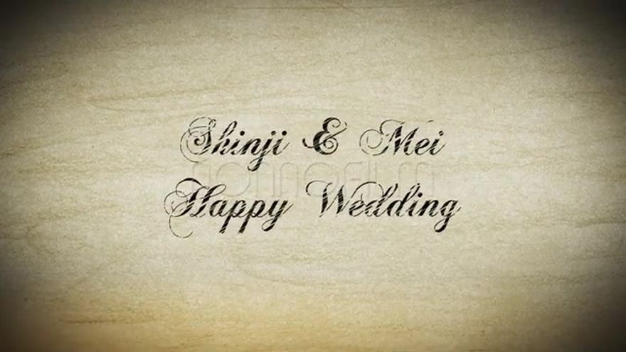 スケッチブックのような質感の背景に、鉛筆で描かれたような「Happy Wedding」の文字と装飾